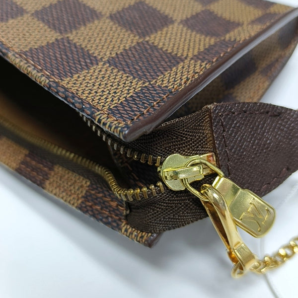 Authenticated pre-owned  BUCKET Damier Ebene Coated Canvas Brown - Clutch at Looply