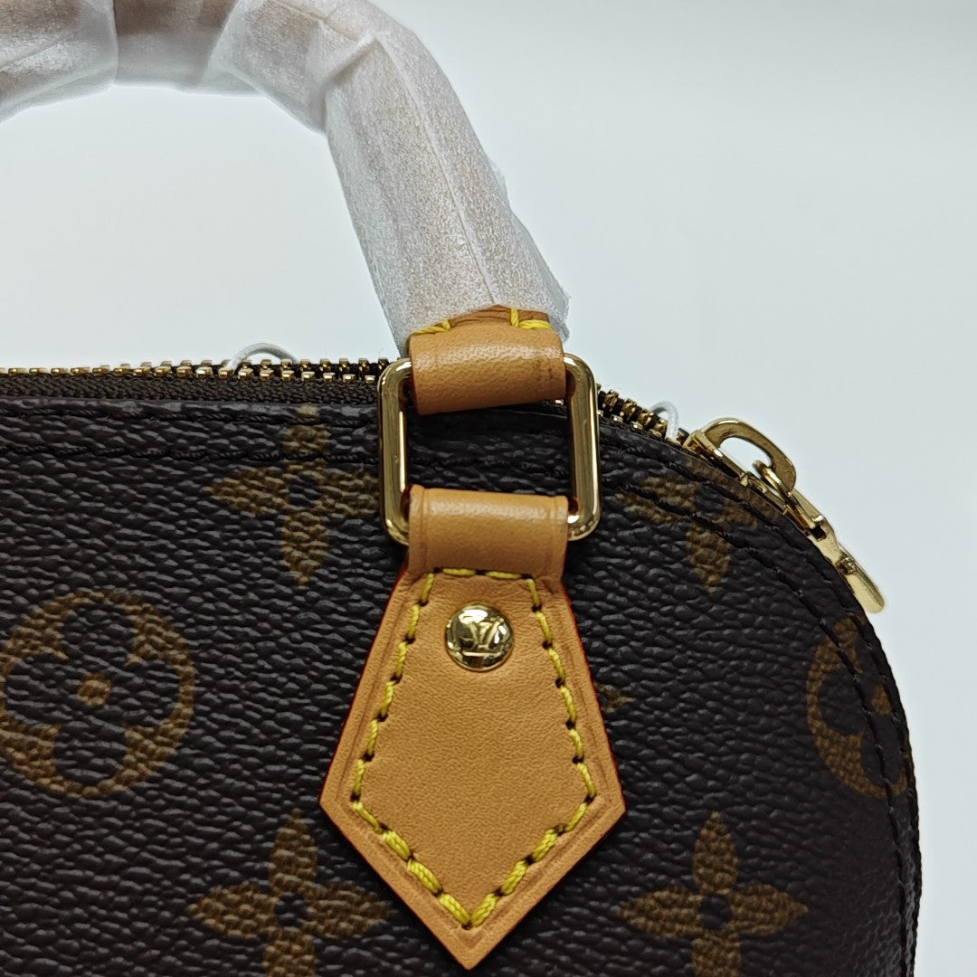 ALMA Mini Monogram Coated Canvas Brown