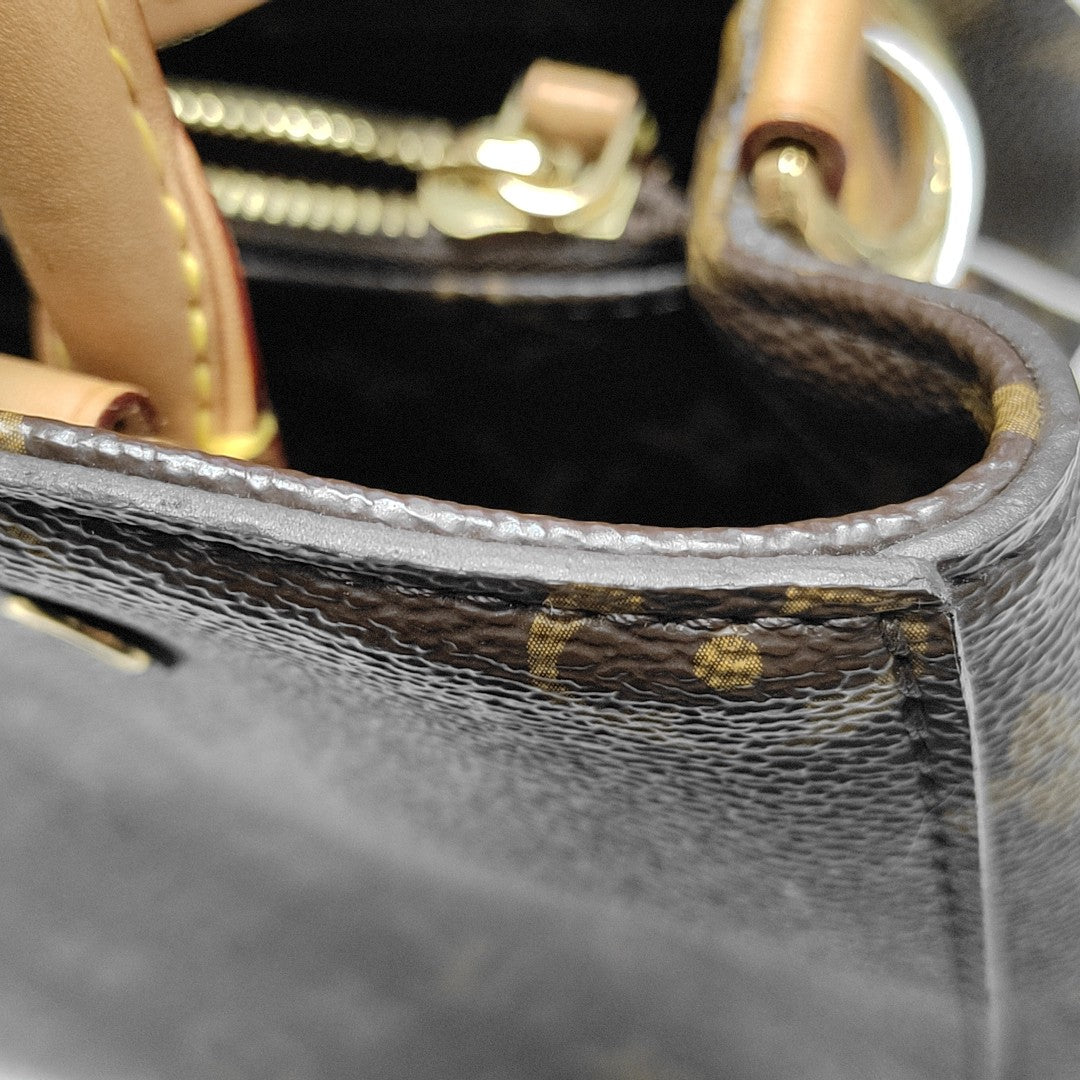 MONTAIGNE GM Monogram Coated Canvas Brown
