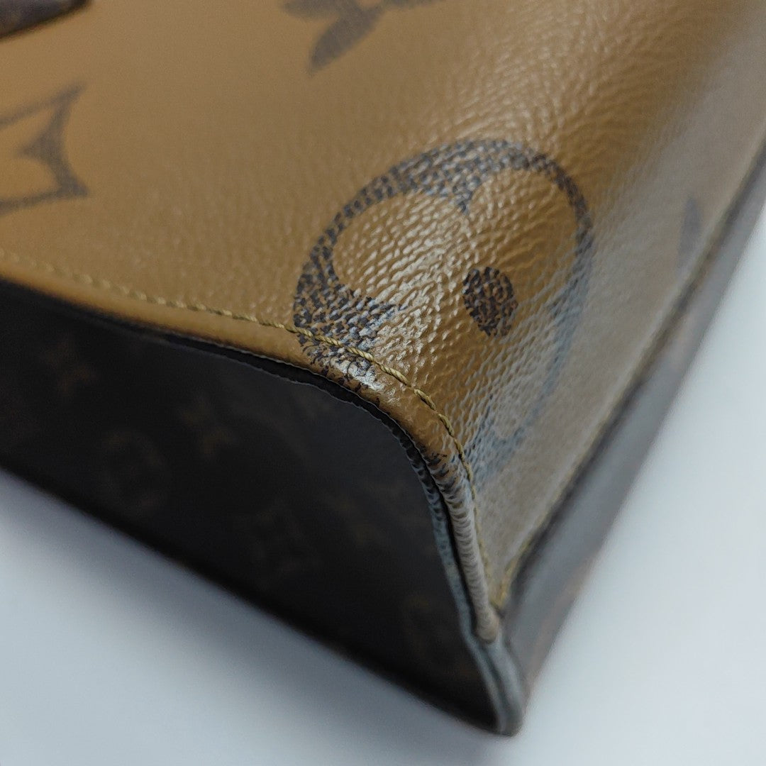 ONTHEGO PM Monogram Coated Canvas Brown