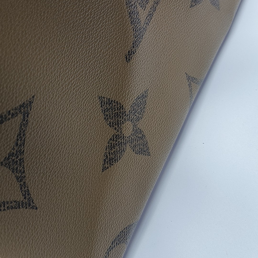 ONTHEGO MM Monogram Coated Canvas Brown