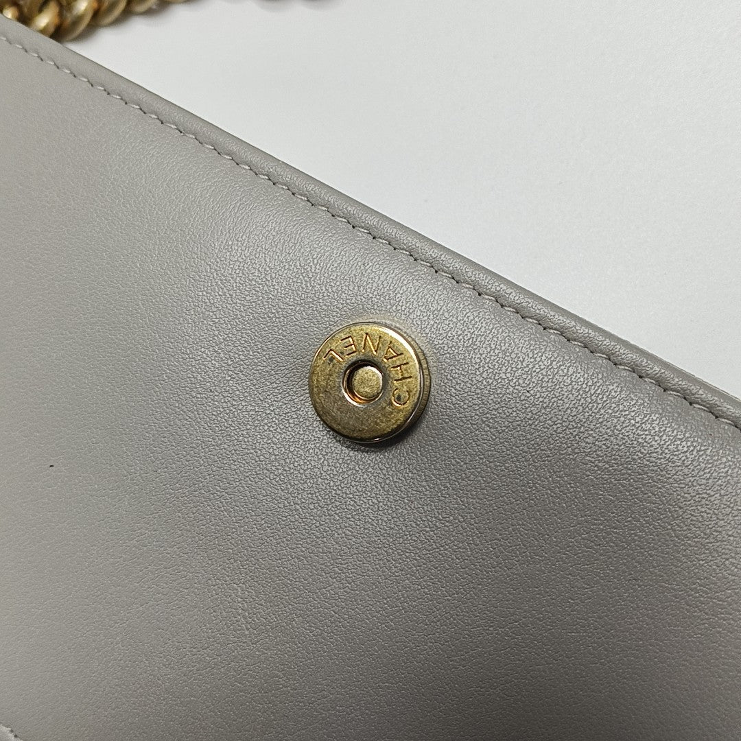 Authenticated pre-owned  BOY CHANEL WOC Quilted Grained Calfskin Grey - Shoulder Bag at Looply