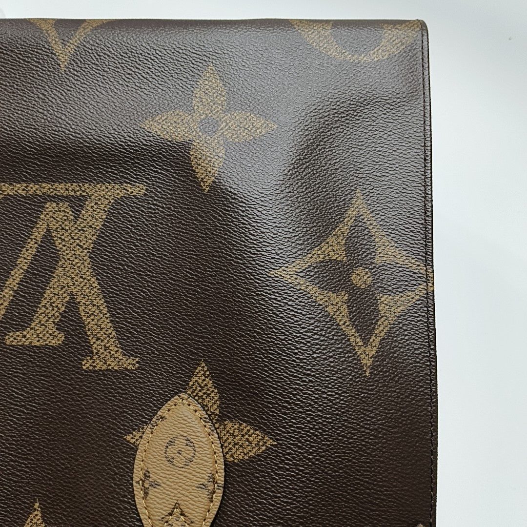 ONTHEGO MM Monogram Coated Canvas Brown