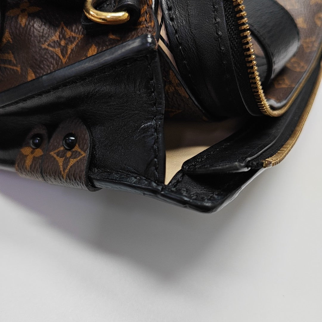 TRUNK Monogram Coated Canvas Brown