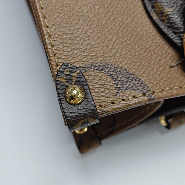 ONTHEGO PM Monogram Coated Canvas Brown