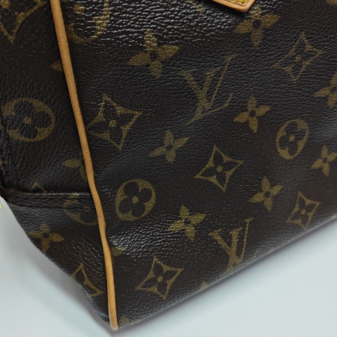 MANHATTAN PM Monogram Coated Canvas Brown