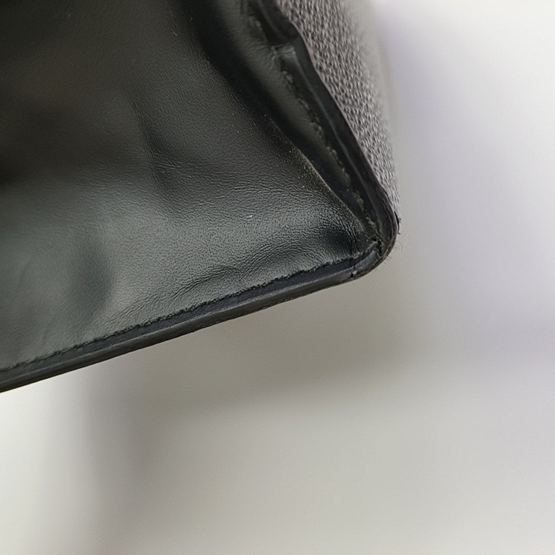 Pochette Voyag MM Monogram Coated Canvas Black