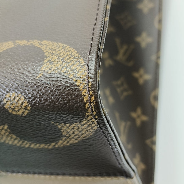 ONTHEGO MM Monogram Coated Canvas Brown