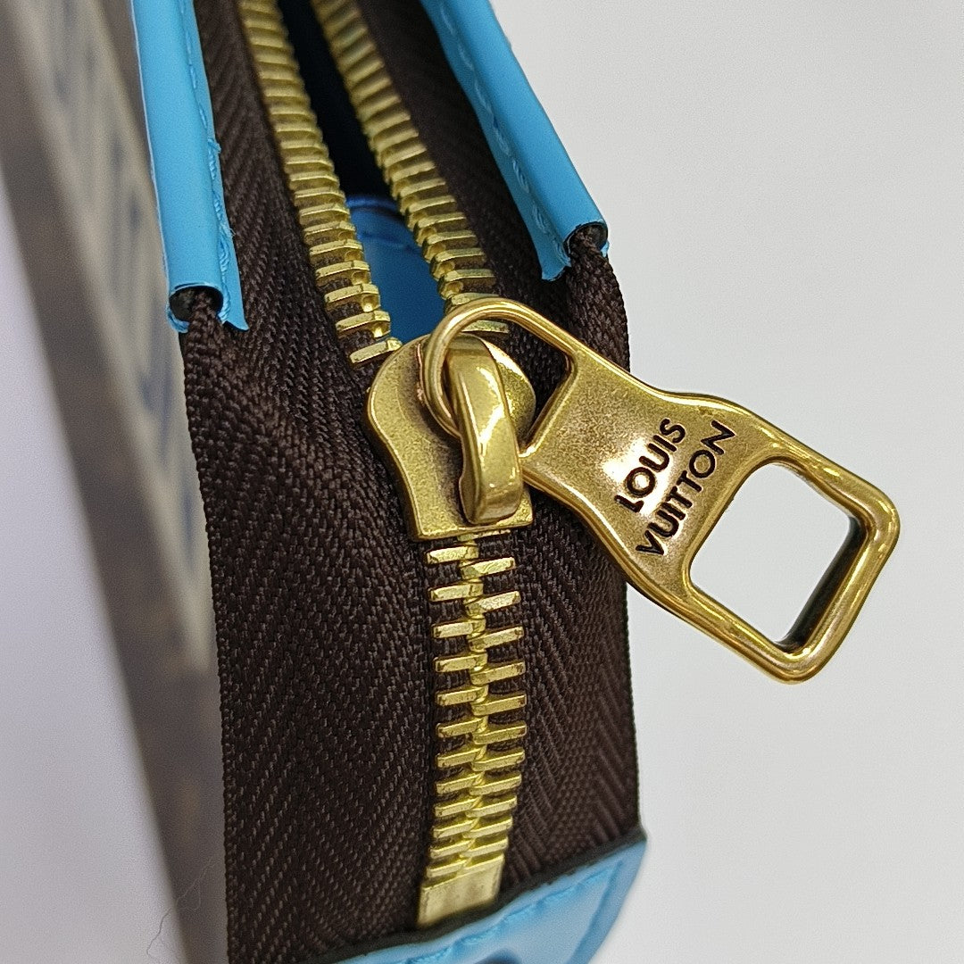 Pochette Voyag MM Monogram Coated Canvas Brown