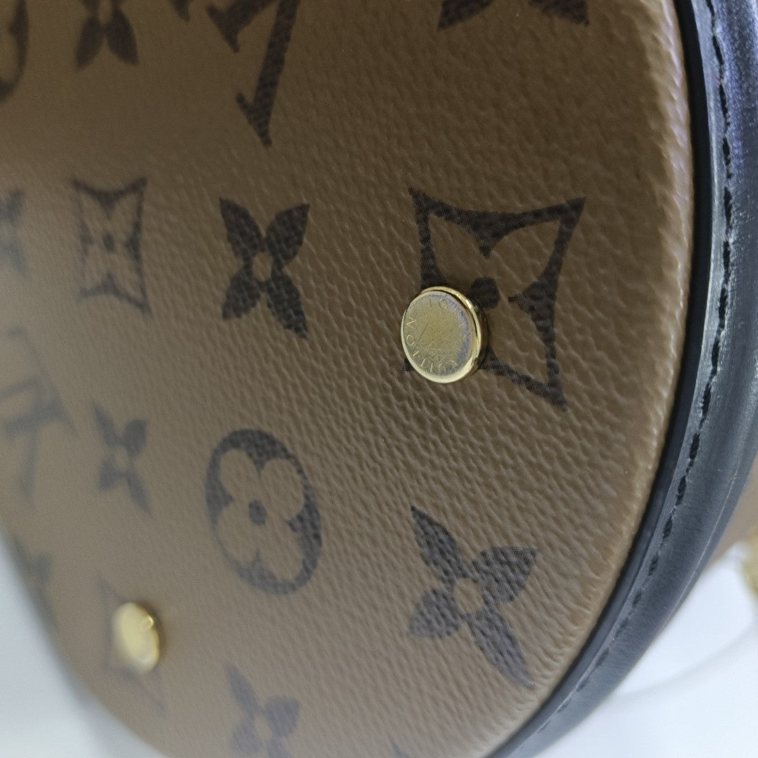 CANNES PM Monogram Coated Canvas Brown