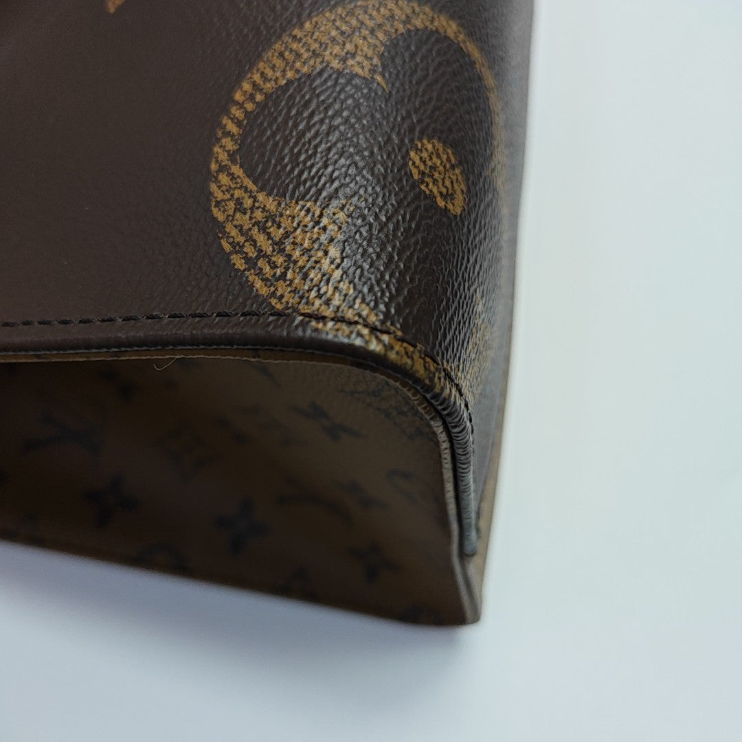ONTHEGO MM Monogram Coated Canvas Brown