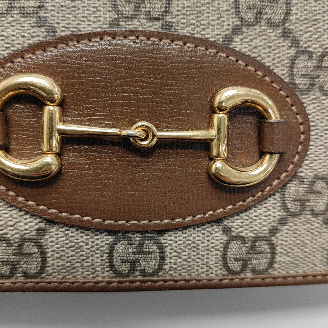 Authenticated pre-owned  Horsebit 1955 WOC Monogram Coated Canvas Beige - Shoulder Bag at Looply