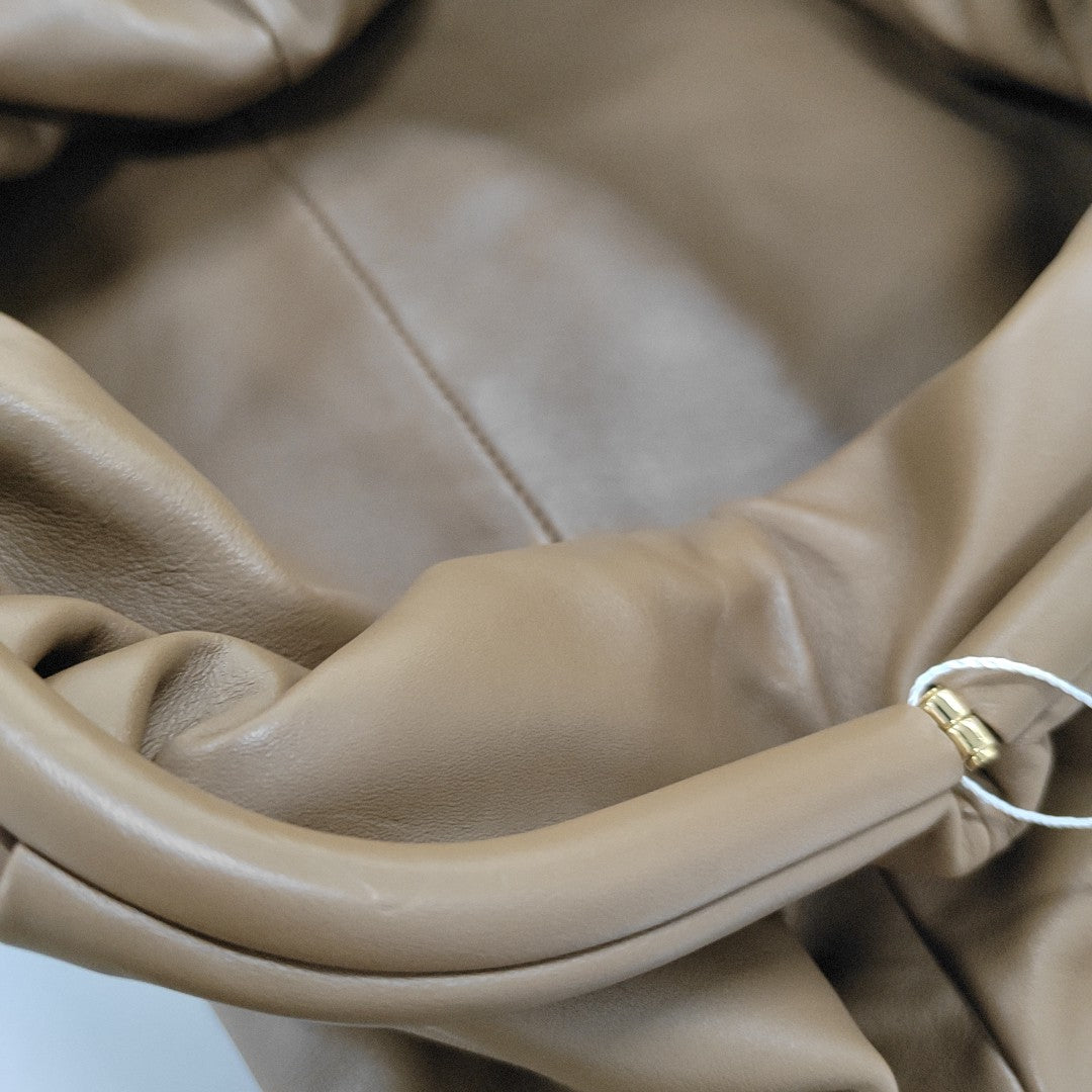 Authenticated pre-owned  The Pouch Calfskin Brown - Clutch at Looply