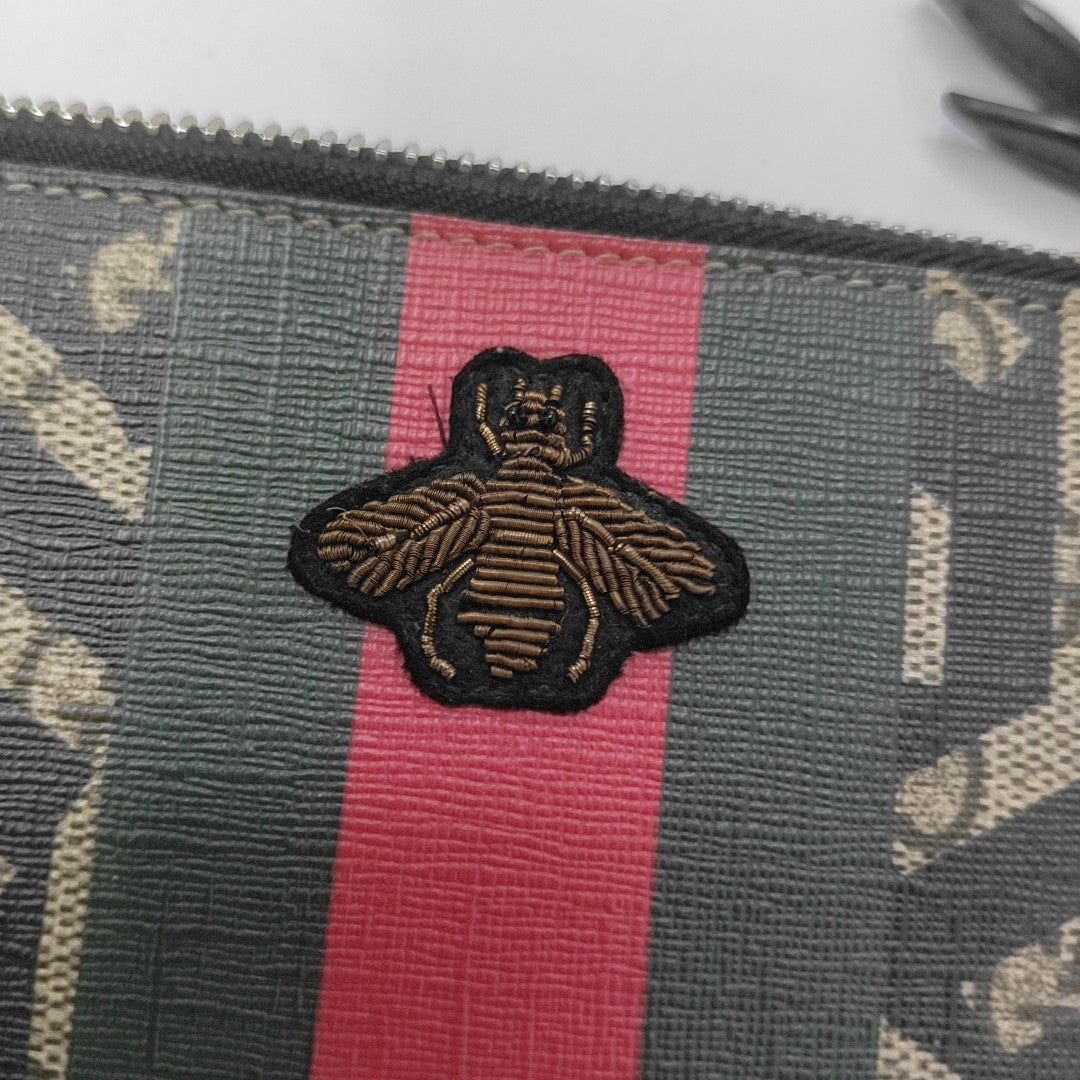 Monogram Coated Canvas Clutch Multicolor
