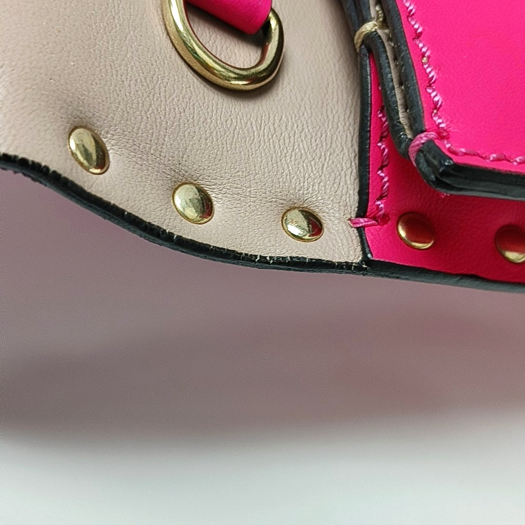 Authenticated pre-owned  Rockstud Lambskin Pink - Clutch at Looply