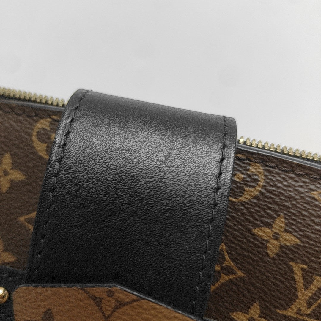 TRUNK Monogram Coated Canvas Brown