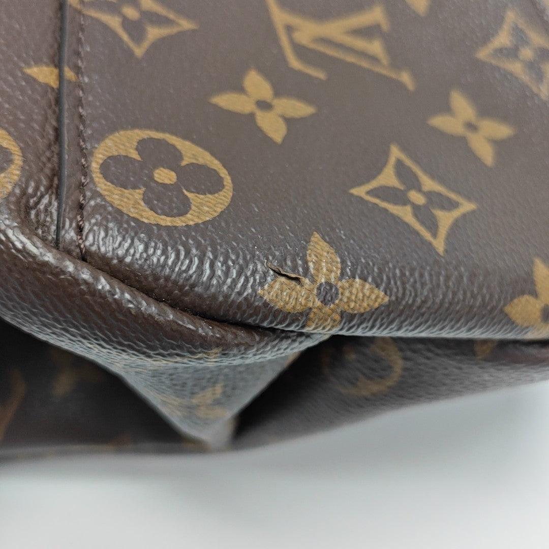 RIVOLI MM Monogram Coated Canvas Brown