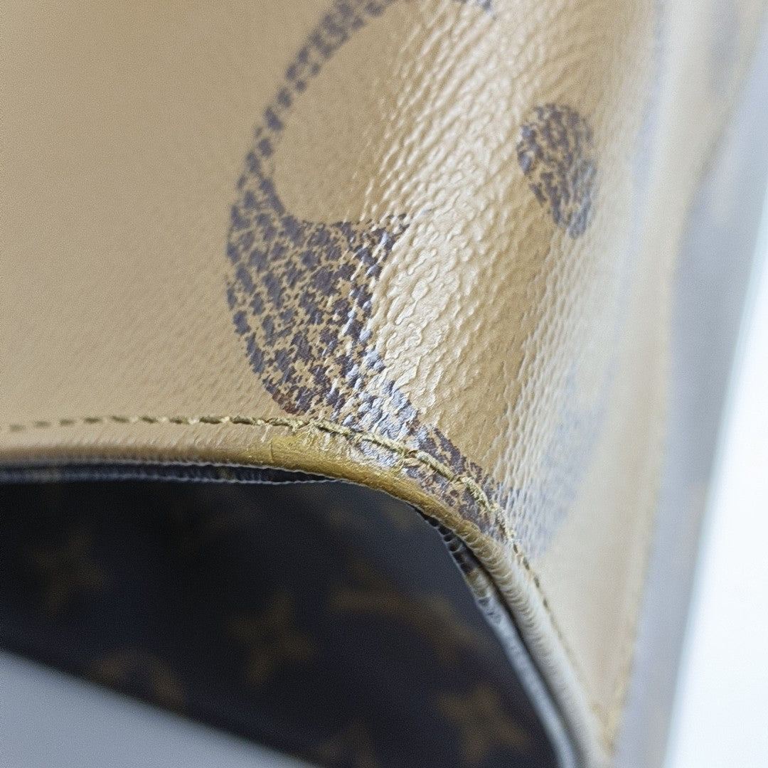 ONTHEGO MM Monogram Coated Canvas Brown