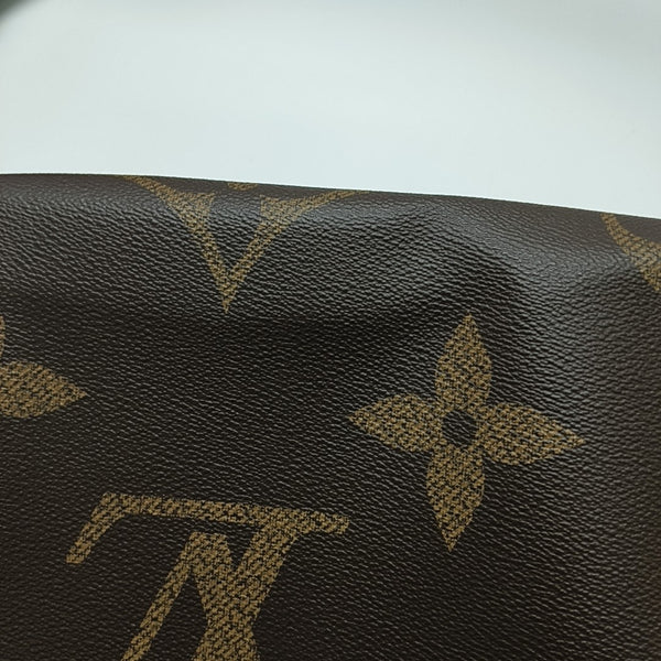 ONTHEGO MM Monogram Coated Canvas Brown