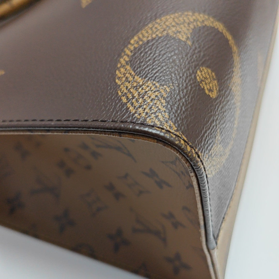 ONTHEGO MM Monogram Coated Canvas Brown
