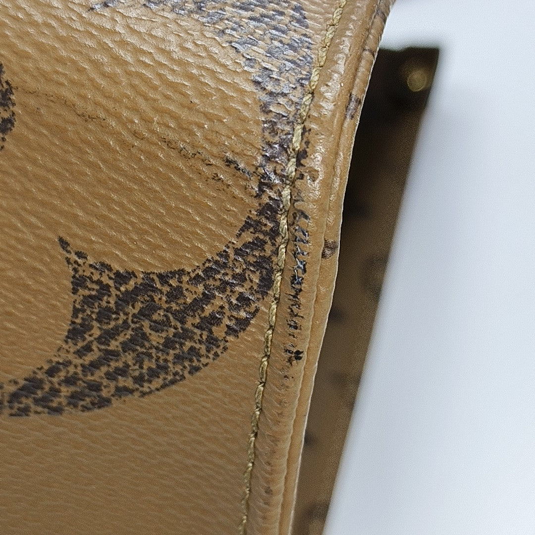 ONTHEGO MM Monogram Coated Canvas Brown