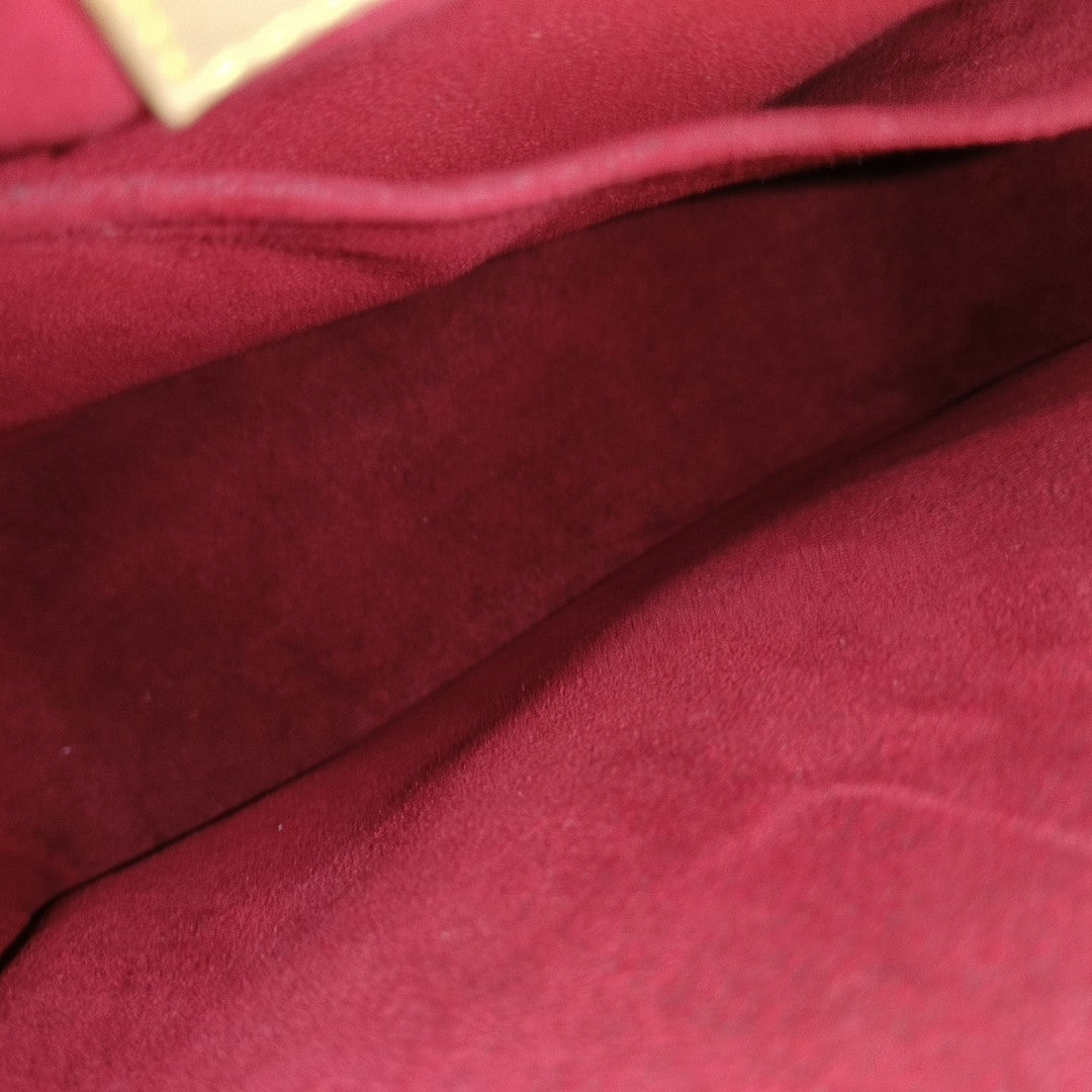 EXCENTRI-CITE Monogram Coated Canvas Brown
