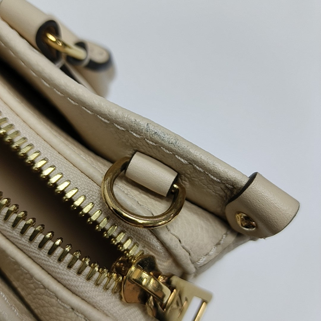 ONTHEGO EAST WEST Monogram Calfskin Beige