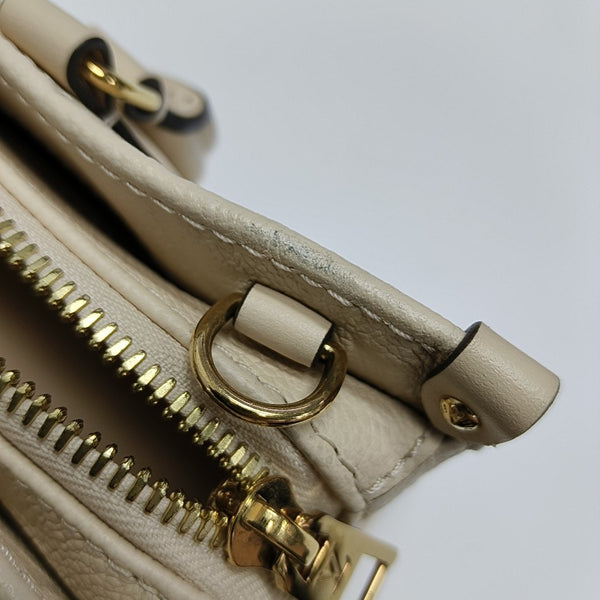 ONTHEGO EAST WEST Monogram Calfskin Beige