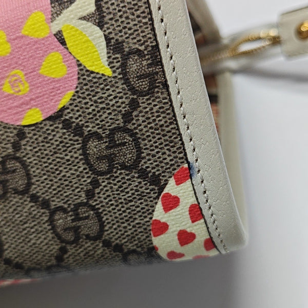 Monogram Coated Canvas Clutch Brown
