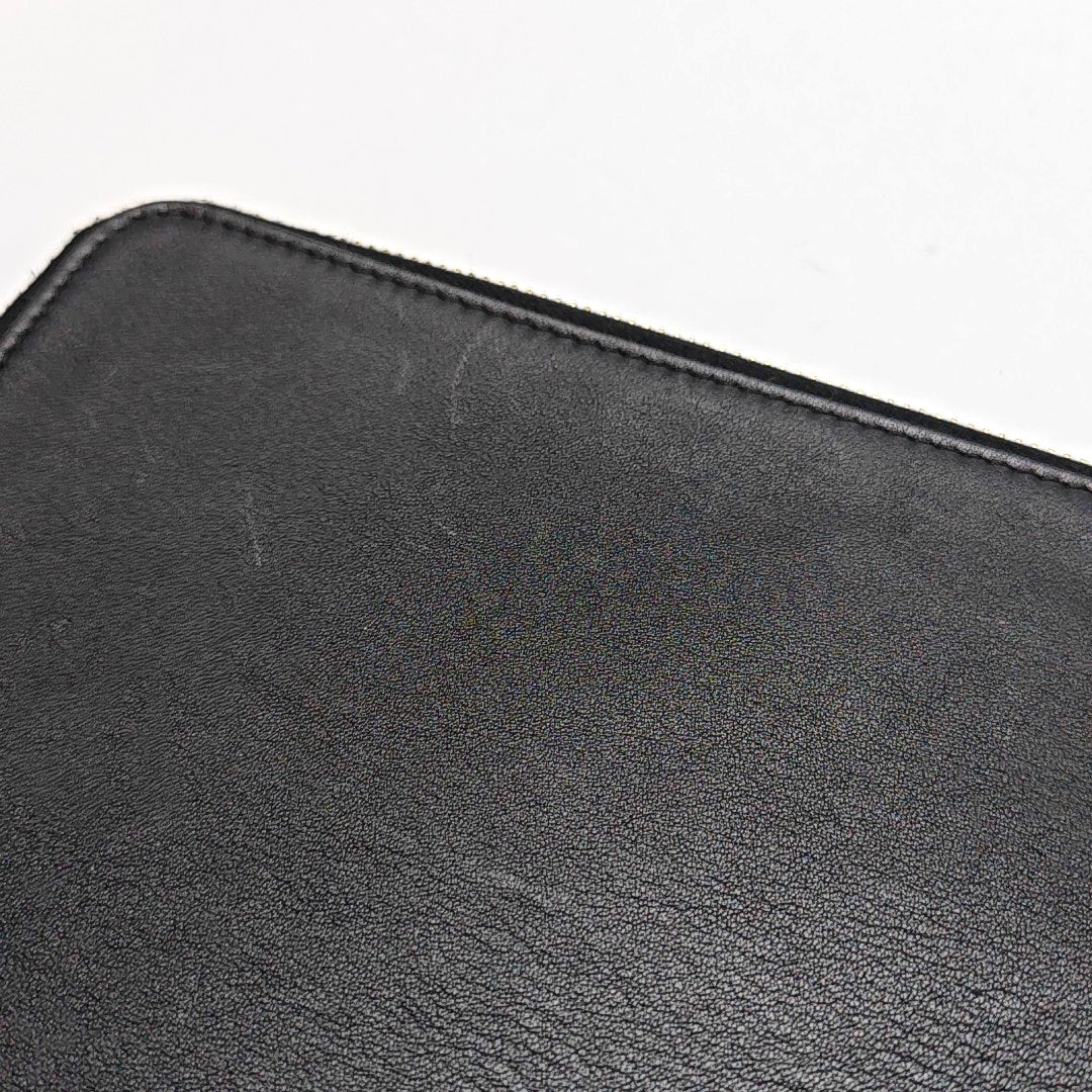 Authenticated pre-owned  Monster Leather Black - Clutch at Looply