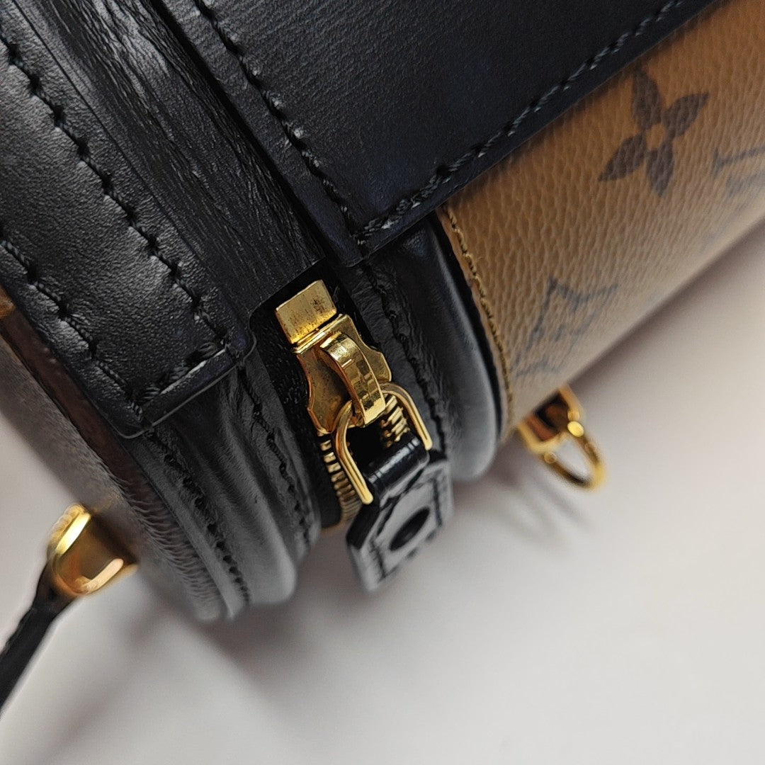 CANNES PM Monogram Coated Canvas Brown