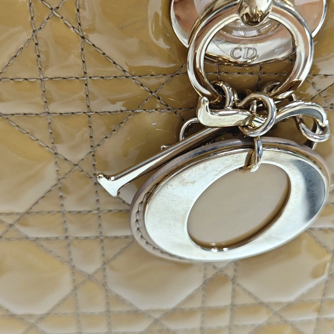 Authenticated pre-owned  Lady Dior Medium Quilted Patent Leather Beige - Top Handle Bag at Looply