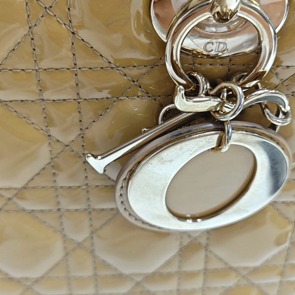 Authenticated pre-owned  Lady Dior Medium Quilted Patent Leather Beige - Top Handle Bag at Looply