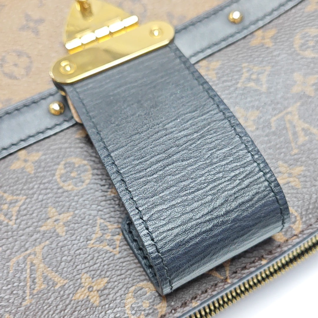 TRUNK Monogram Coated Canvas Brown