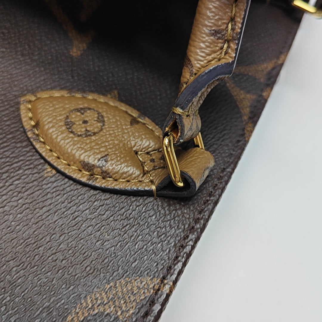 ONTHEGO PM Monogram Coated Canvas Brown