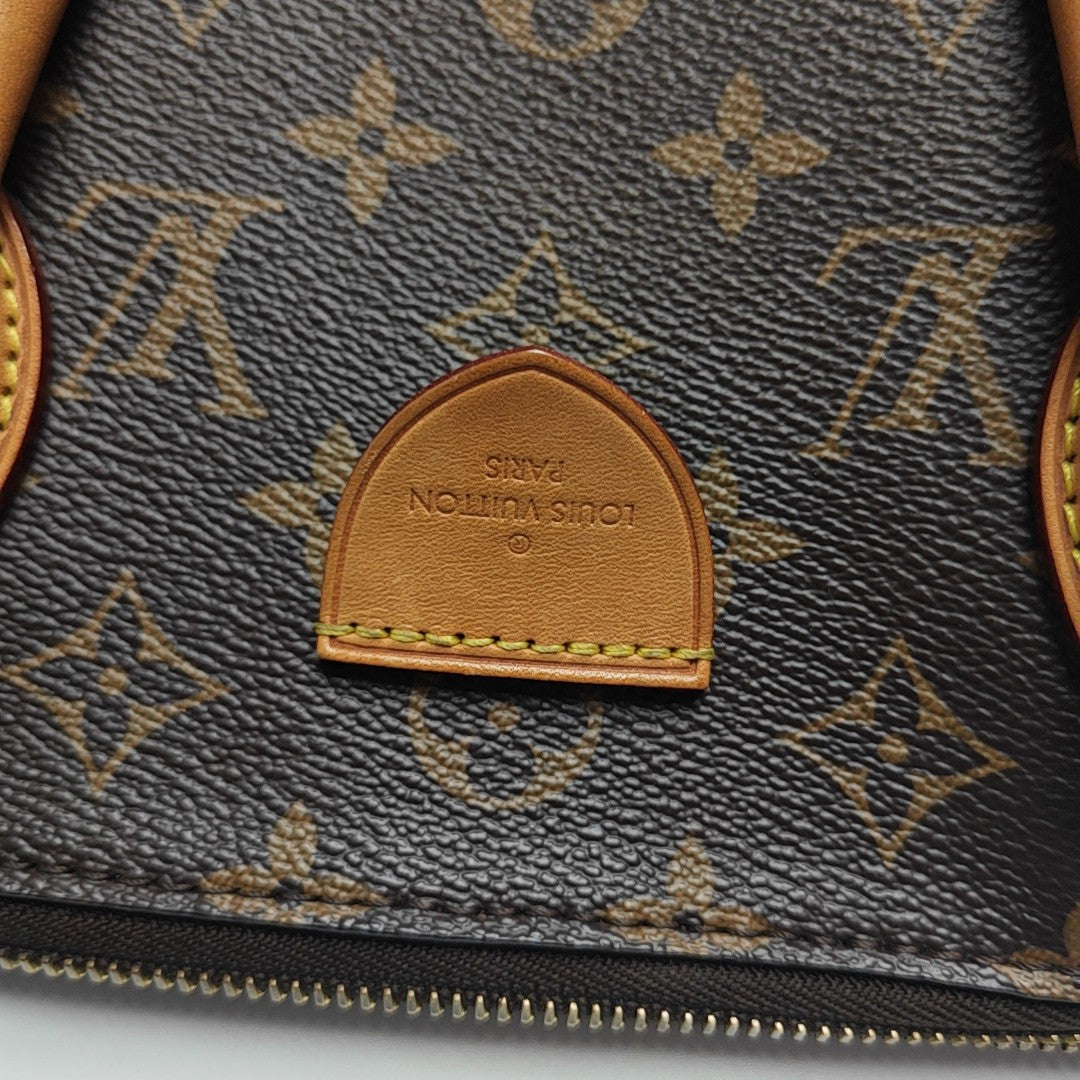 RIVOLI MM Monogram Coated Canvas Brown