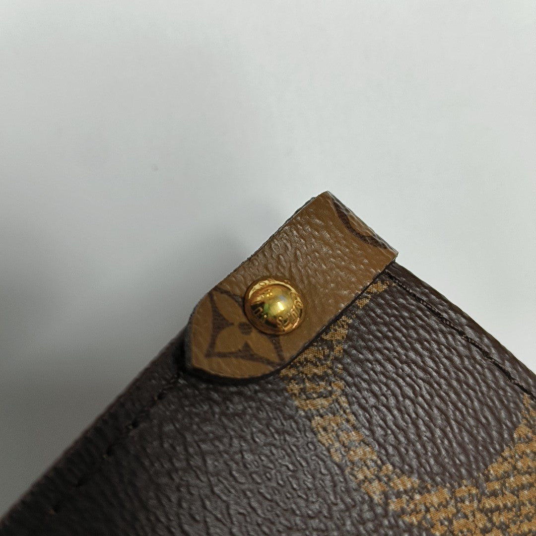 ONTHEGO MM Monogram Coated Canvas Brown
