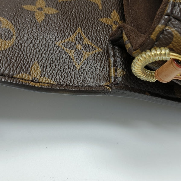 MÉTIS EAST WEST Monogram Coated Canvas Brown