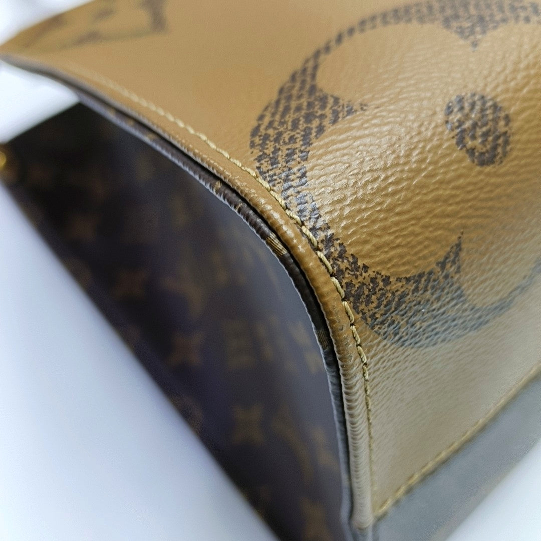 ONTHEGO MM Monogram Coated Canvas Brown