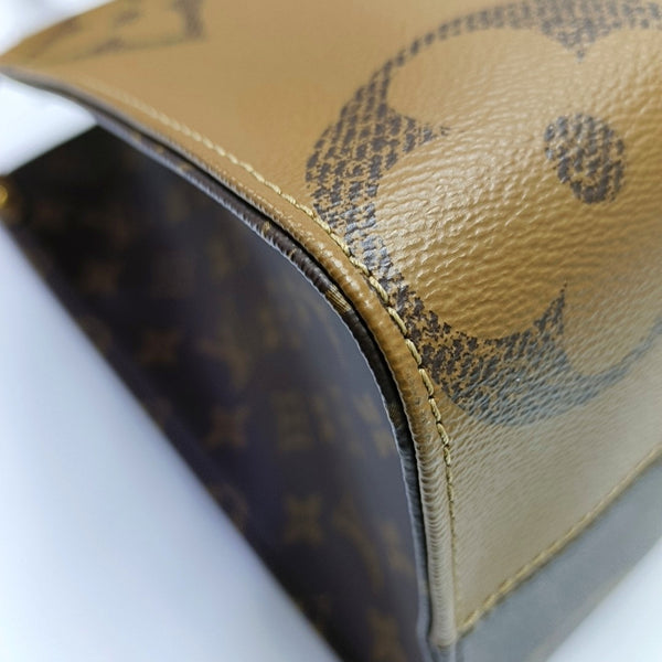 ONTHEGO MM Monogram Coated Canvas Brown