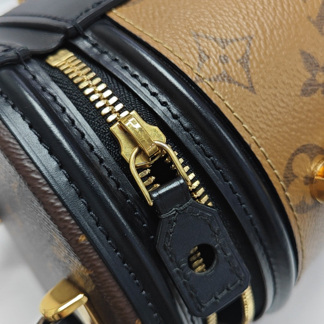 CANNES PM Monogram Coated Canvas Brown