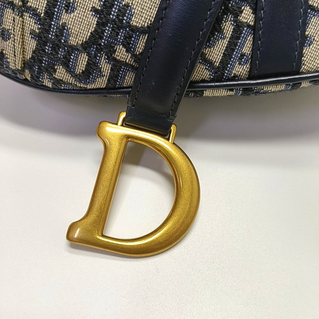 Authenticated pre-owned  Saddle Mini Monogram Canvas Blue - Top Handle Bag at Looply