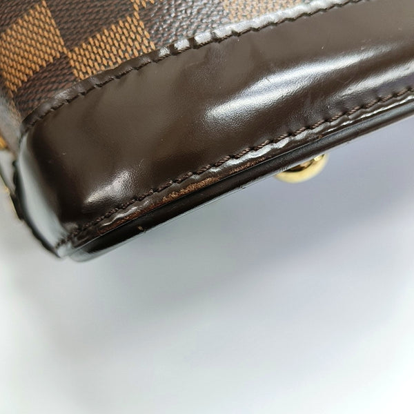 Authenticated pre-owned  ALMA PM Damier Ebene Coated Canvas Brown - Top Handle Bag at Looply