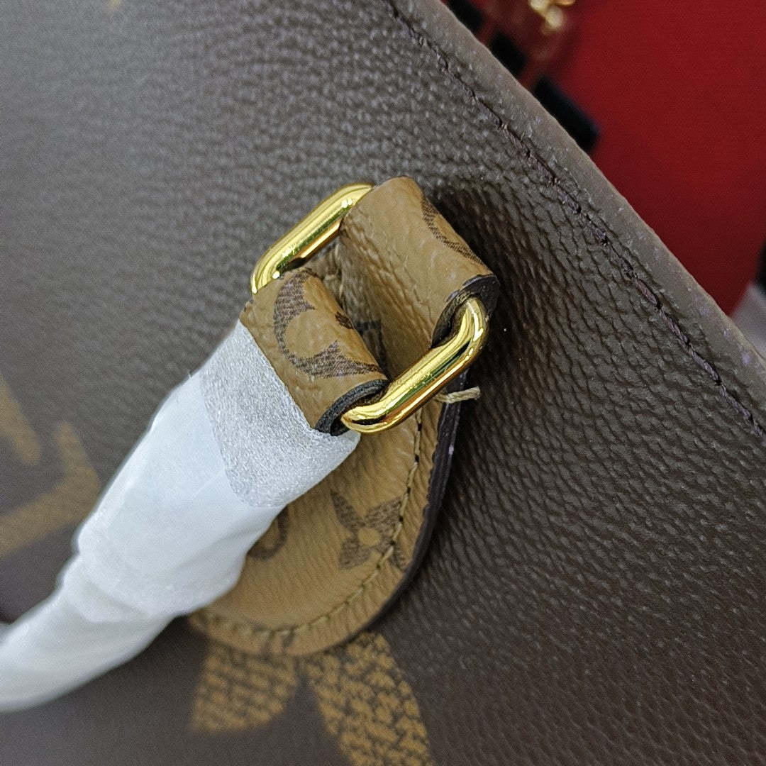 ONTHEGO MM Monogram Coated Canvas Brown