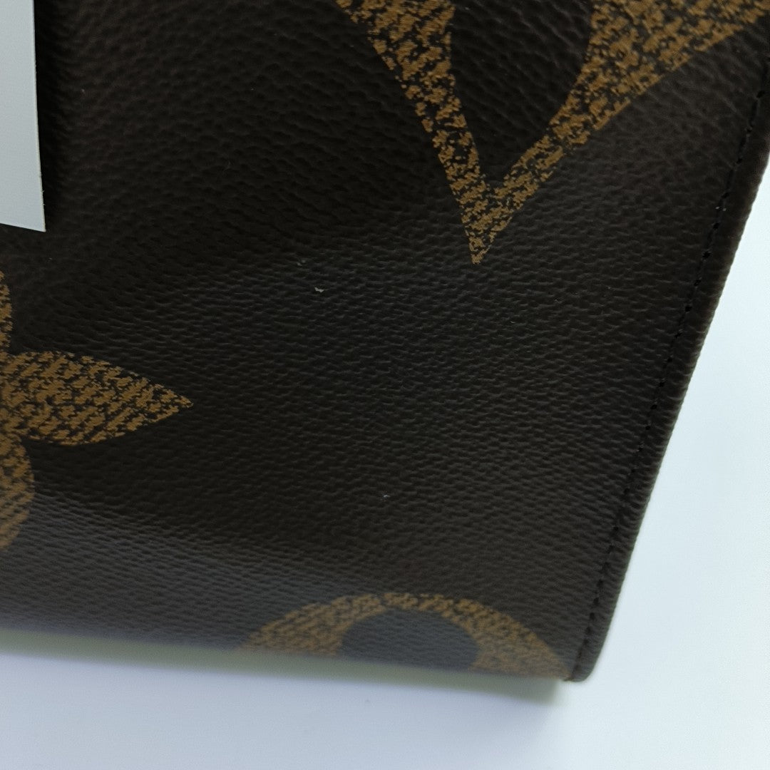 ONTHEGO MM Monogram Coated Canvas Brown