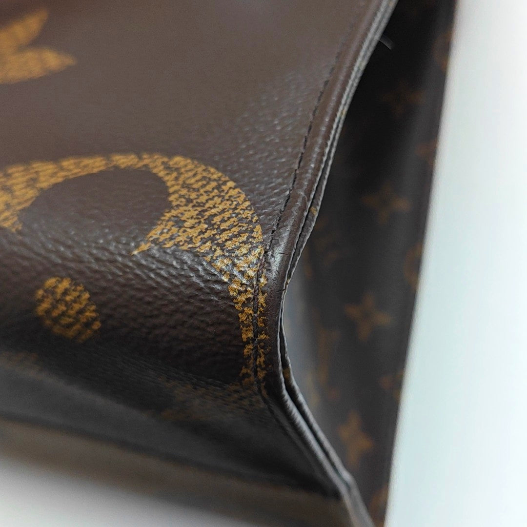 ONTHEGO MM Monogram Coated Canvas Brown