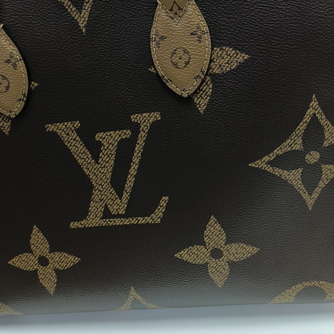 ONTHEGO MM Monogram Coated Canvas Brown