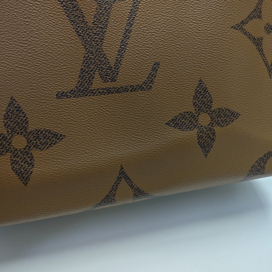 ONTHEGO MM Monogram Coated Canvas Brown