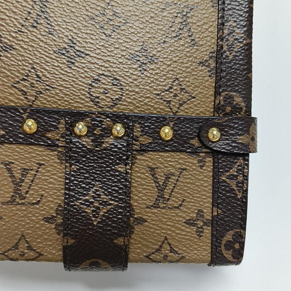 TRUNK Monogram Coated Canvas Brown