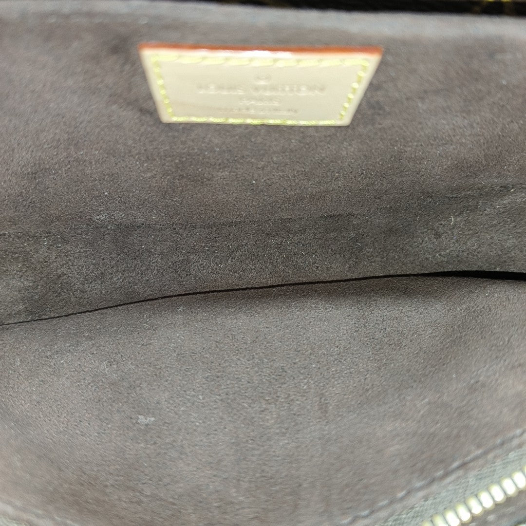 MÉTIS EAST WEST Monogram Coated Canvas Brown